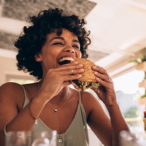 Healthy Dallas patient eating a burger