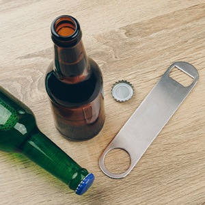 Dallas patient using scissors instead of teeth to open package