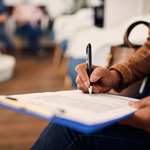 Patient filling out paperwork in lobby