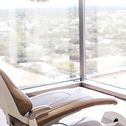 Dental treatment room with hardwood floor in Dallas dental office