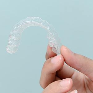 Friends smiling while having coffee together