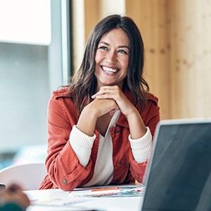 Woman smiling during work meeting at office
